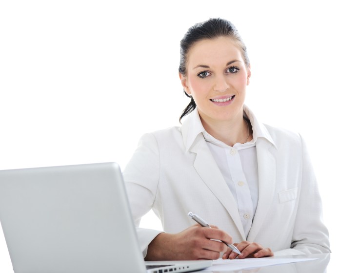 Business woman on desk working on laptop