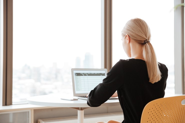 back-view-photo-of-young-woman-worker-sitting-in-office-My Virtual Services.jpg